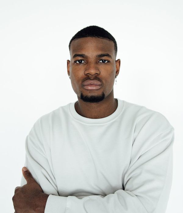 Man looking energetic and focused after a workout, with a calm expression.